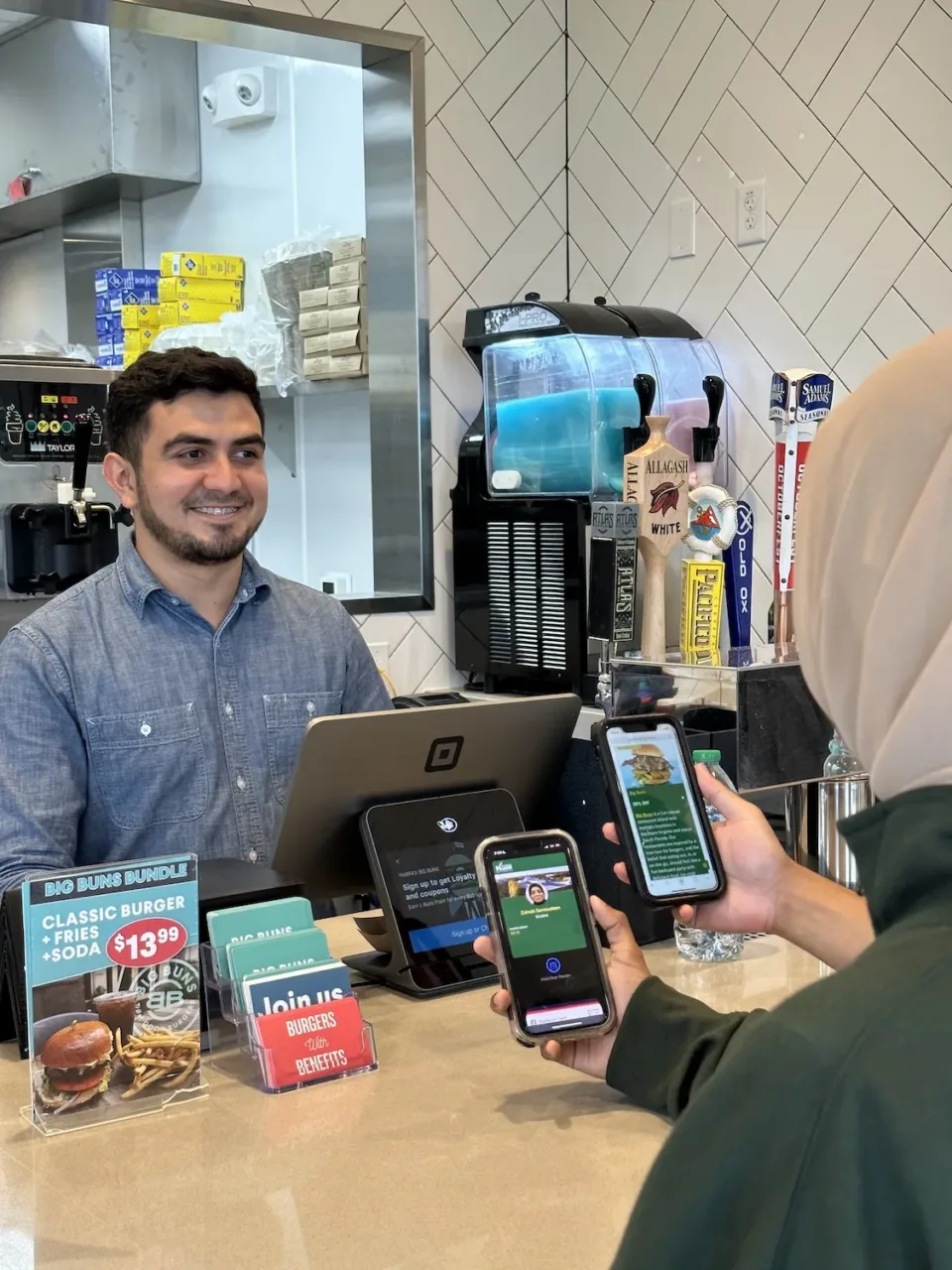 Mason students and employees using their meal plan swipes at Thompson restaurants off campus